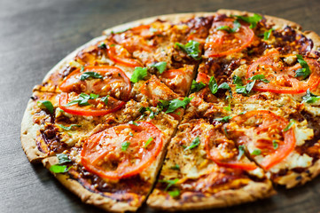 Pizza with Mozzarella cheese, Tomatoes, pepper, Spices and Fresh Basil. Italian pizza. Pizza Margherita or Margarita. on wooden background