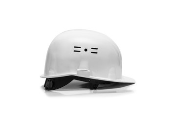 Fototapeta premium Green Plastic safety helmet isolated on white background
