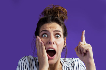 In perplexity the girl shows her fingers in her head with something that surprised her...