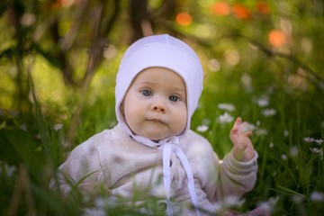 Beautiful infant baby girl portrait  in nature - 221299905