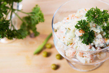 Salad, green peas, mayonnaise, greens,cucumbers, sour cream