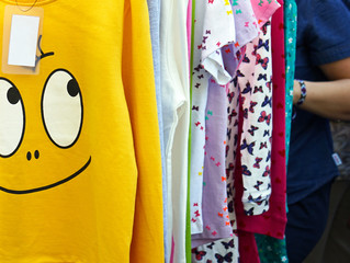 Yellow sweatshirt with a positive, smiling face.