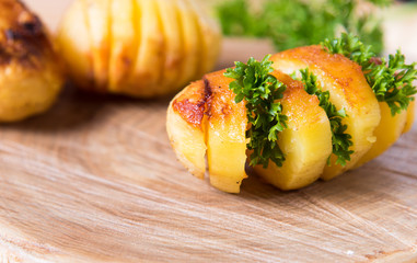 Baked potatoes with garlic and herbs.