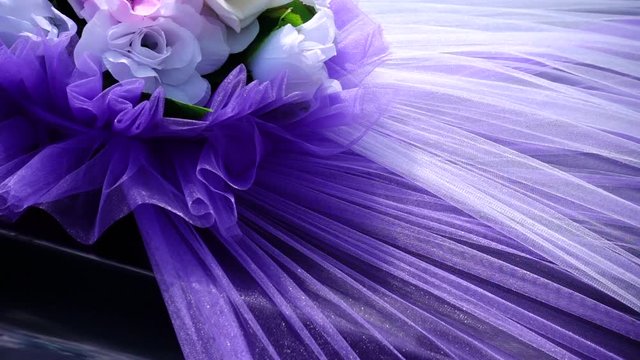 Purple fabric on the hood of the car.