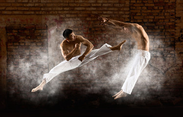 Two male karate fighting