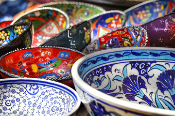 Bright handmade decorative painted ceramic plates of different motifs