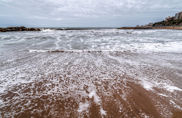 waves of the Atlantic Ocean rolling on the sand