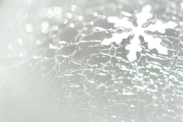 Christmas and New Year. Snowflake against the background of cracked ice. Christmas festive background
