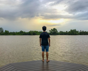 abstract a man stand and look out sky feel sad