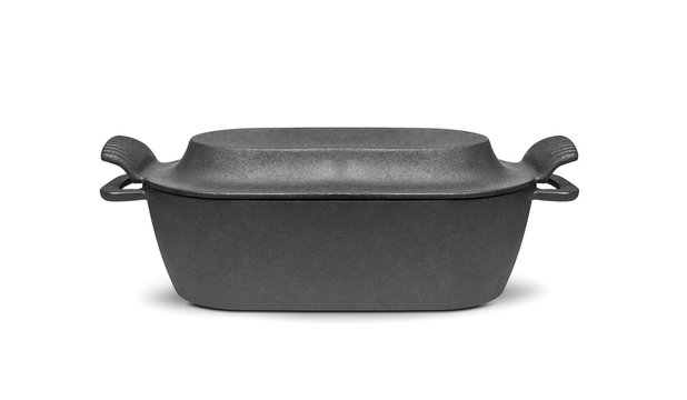 Cast iron pan with lid, isolated on white background
