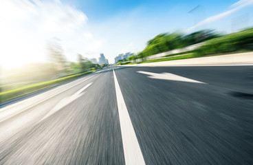 Fototapeta premium empty asphalt road with city skyline