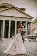 Fototapeta premium Young wedding couple by Pantheon in Rome, Italy