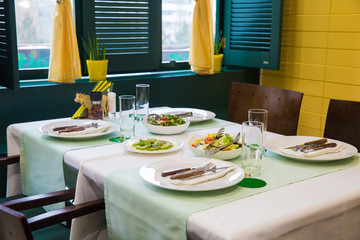 Cafe, table setting, yellow and green color