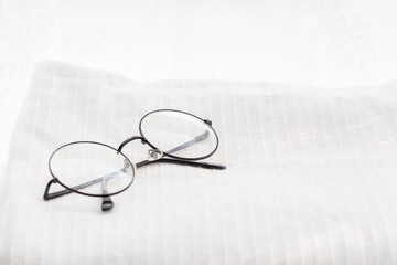 Glasses on white towel