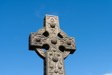 The top of a fine carved Celtic Cross gravestone memorial close to Stirling Castle in Scotland.