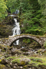 Ancient Roman bridge and waterfalls at Glen Lyon, Perthshire, Scotland.
