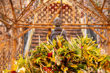 Inthakin City Pillar Festival Chiang Mai worship of the city pillar tradition of flower offering to the pillar is a festival every year at Wat Chedi Luang in Chiang Mai Thailand.