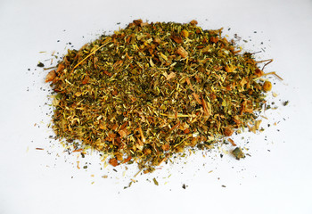 Bright multi-colored dry herbal herbal mixture on a white background from different plants