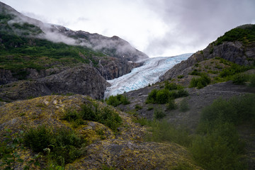 Fototapeta na wymiar View of Exit Glacier near Seward, AK on an overcast day at the beginning of the Harding Ice Field trail in Kenai Fjords National Park
