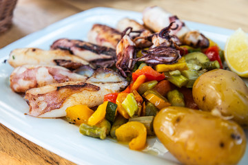 Mediterranean Octopus with vegetables and potatoes