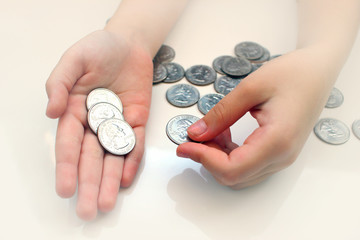 Hands hold coins for financial and money-saving concepts, saving money, currency earnings, toned