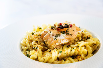 tasty pasta with salmon on a the table