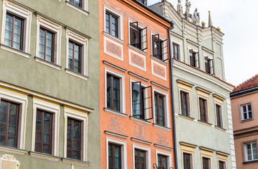 Fototapeta na wymiar Warsaw / Poland - August 20 of 2018 : Street with colorful houses in Warsaw city. European architecture of old town in Poland. Concept of travel and city landscape.