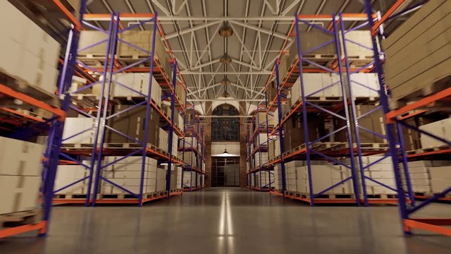Pallets with boxes on the shelves in the large industrial loft warehouse.