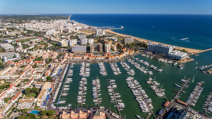 Fototapeta premium Aerial view of the bay of the marina, with luxury yachts in Vilamoura.