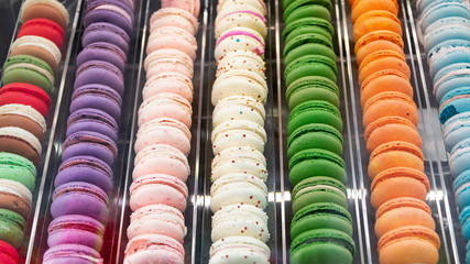 French macaron dessert, lots of colorful macarons in the pastry shop window in Paris