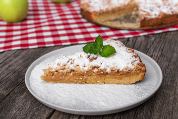 Slice of apple pie on a plate.