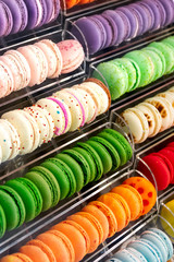 French macaron dessert, lots of colorful macarons in the pastry shop window in Paris