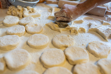 Making of kibinai - Lithuanian traditional pastry pie with meat.