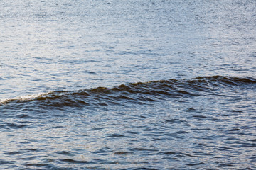 A single wave on the surface of a river