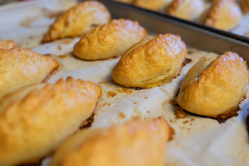 Making of kibinai - Lithuanian traditional pastry pie with meat.