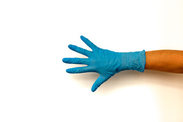 woman's hand in a rubber glove. Isolate on white background. The concept of the work of a cook in a restaurant