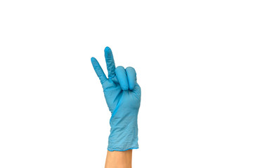 Isolate woman's hand showing two fingers in a blue rubber glove on a white background. The gesture of victory. The concept of successful work of a chef of a surgeon or cleaning