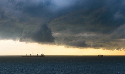 Tropical thunderstorm at anchorage of Vung Tau, Vietnam in Mekong river delta