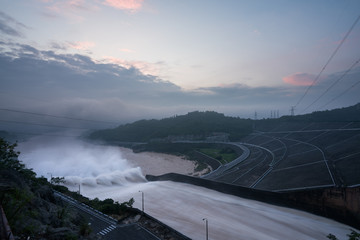 Smooth draining water from the hydroelectric dam at dawn