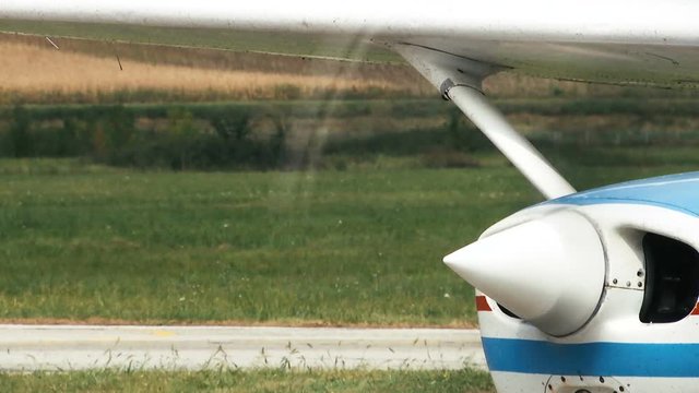 a propeller that spins fast on a small airplane -  standing in place,closeup shoot
