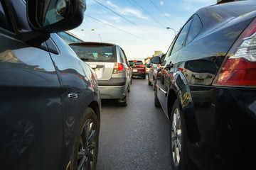 Cars on city street in traffic jam at rush hour
