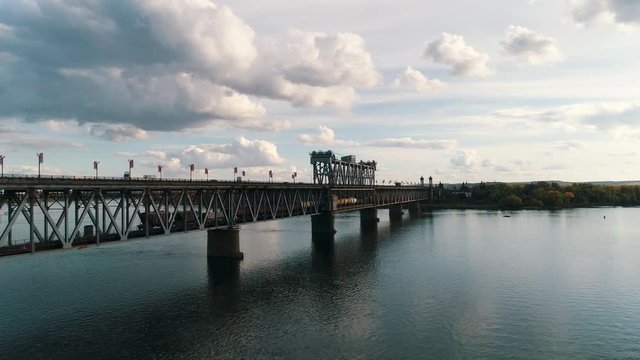 freight train rides over the bridge.