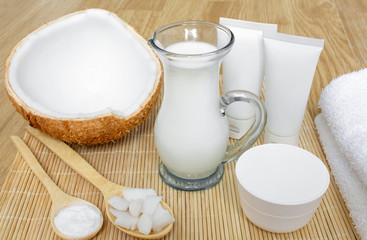 Coconut in cosmetology. Сream, balm, coconut milk. Skin, body and face care. Cosmetology. Nutrition and hydration. Homemade coconut products. Wooden spoons with coconut pulp and in powder.