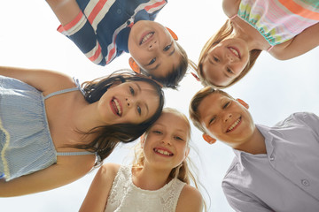 childhood, friendship and people concept - group of smiling happy children in circle
