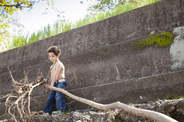 Boy Carrying Branch