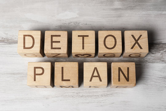 DETOX PLAN text on wooden cubes on wooden background