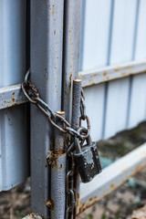 Old padlock and chain on the gate