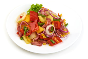 Healthy snack of assorted farm fresh roast vegetables in a white plate, isolated on white backgound.