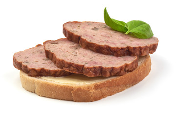 Traditional baked meatloaf slices sandwich with basil leaves, isolated on white background.