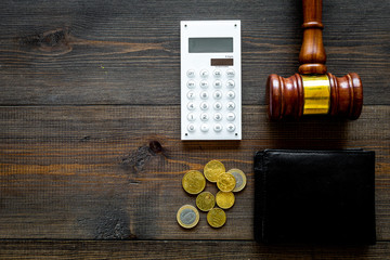 Financial failure, bankruptcy concept. Judge gavel, wallet, coins, calculator on dark wooden...